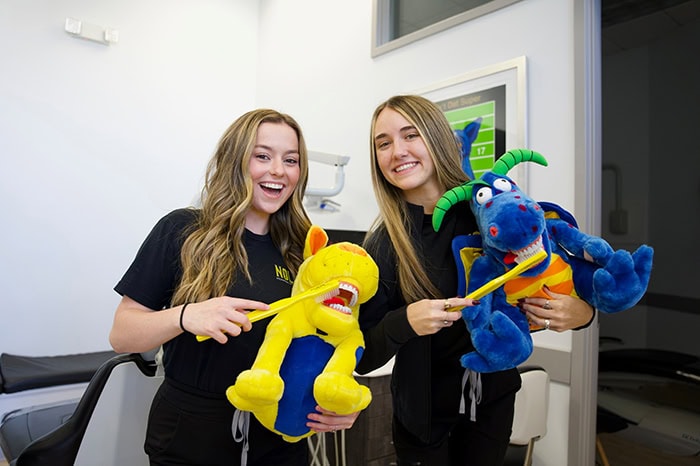 NOLA Team brushing teeth of stuffed animal
